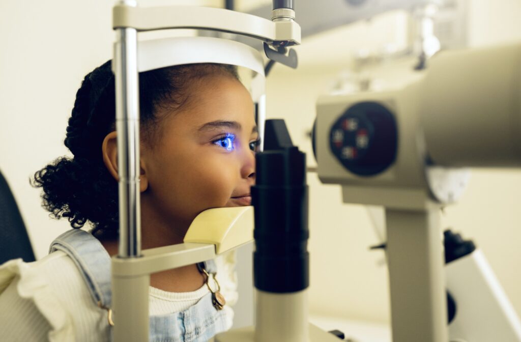 Young girl having an eye exam with digital equipment.