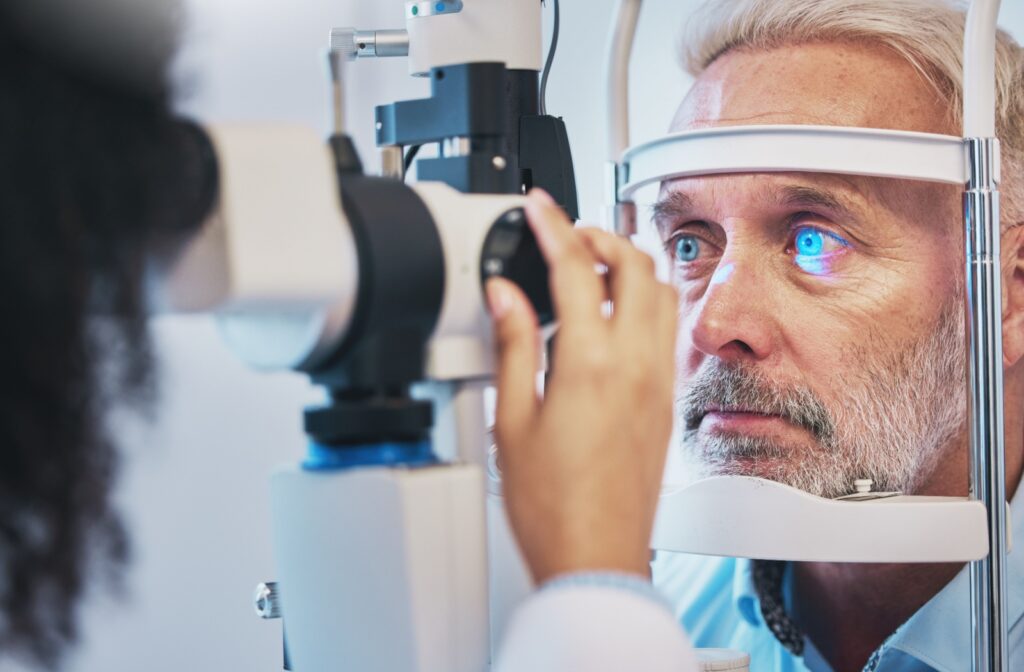 Patient receiving an eye exam with a laser device to check for signs of glaucoma.