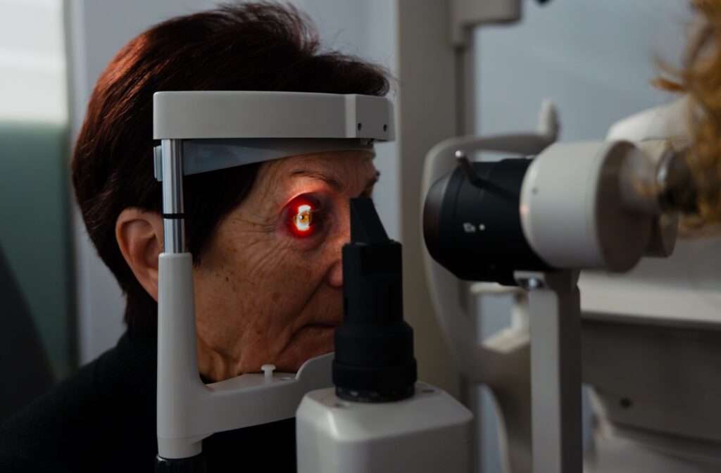 An optometrist uses a slit lamp to evaluate a patient's symptoms.